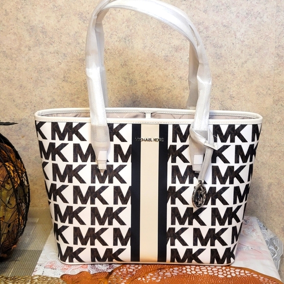Michael Kors Handbags - NWOT Michael Kors canvas Travel tote  bag